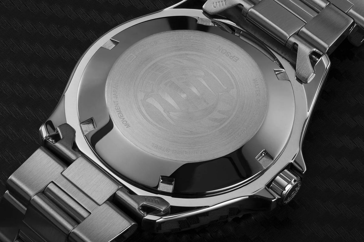 Stainless steel watch caseback with smooth circular back and side lugs