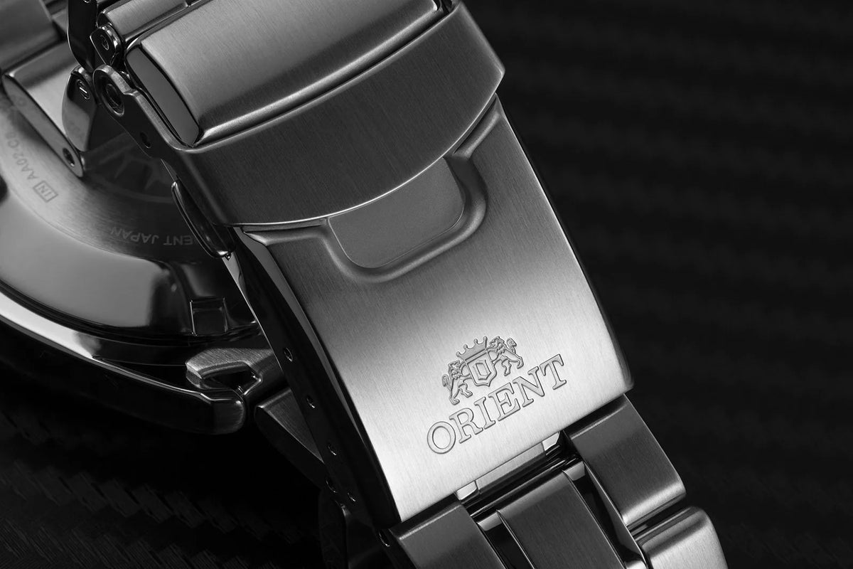 Stainless steel bracelet clasp with Orient logo and polished link detail