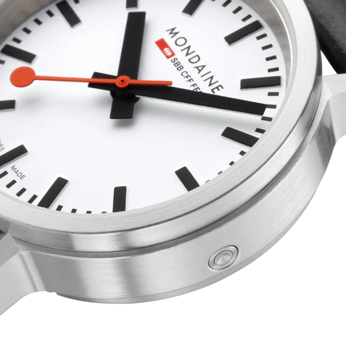 Mondaine quartz watch case and dial detail with orange hands and silver bezel