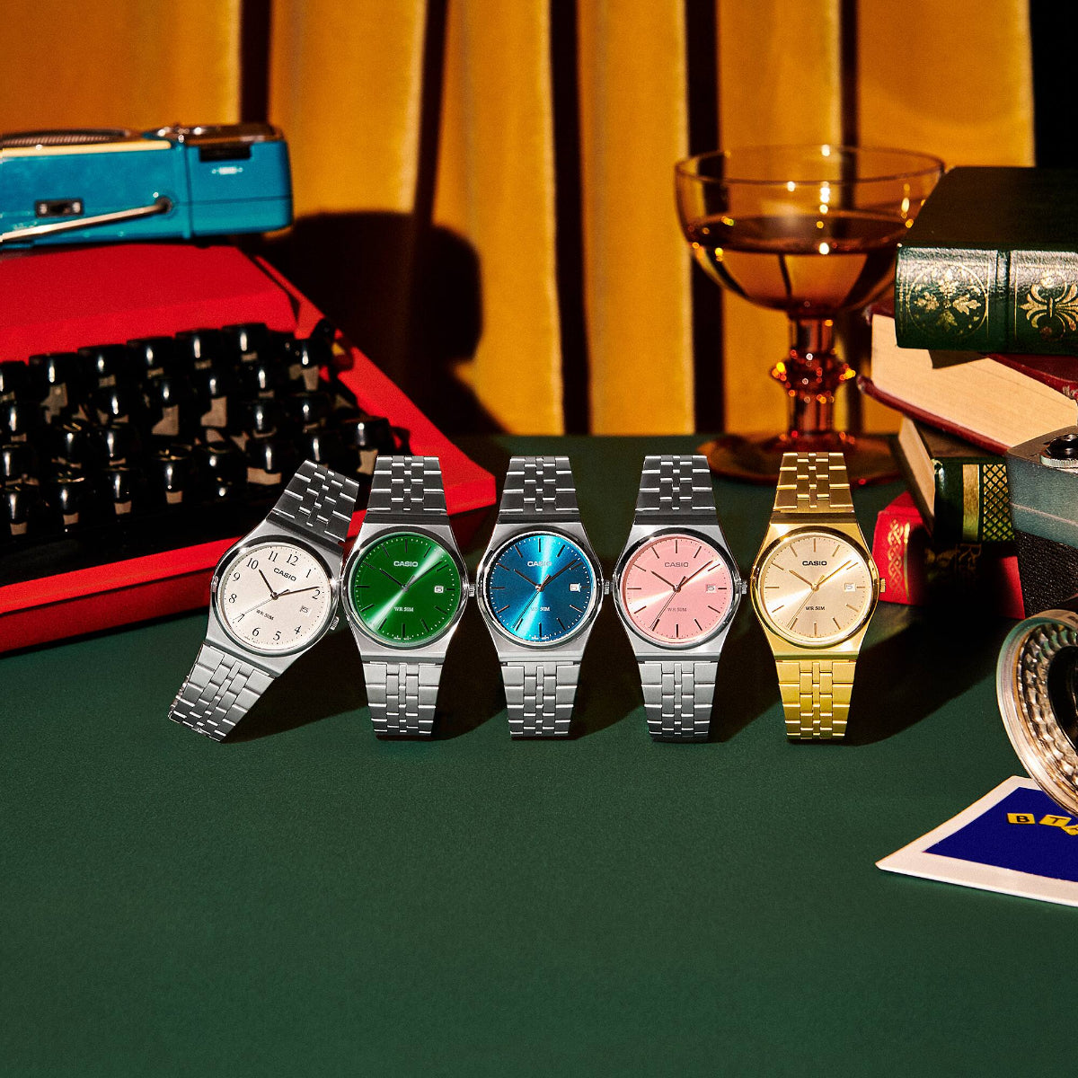 Group shot of the Casio MTP Collection, including the MTP-B145D-2A2VEF blue dial model set against vintage props