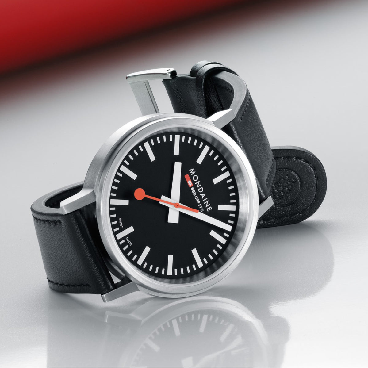 Mondaine SBB classic watch with black dial, white hour markers, and black leather strap
