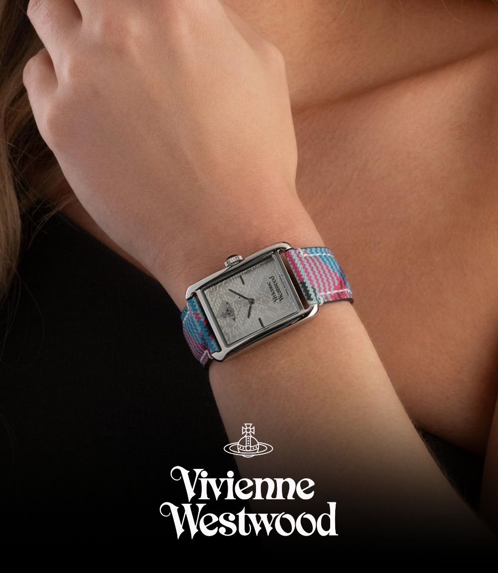 Close-up of a rectangular-faced Vivienne Westwood watch worn on a wrist, featuring a silver-tone dial with delicate detailing and a colourful plaid fabric strap, featuring the Vivienne Westwood orb logo at the bottom