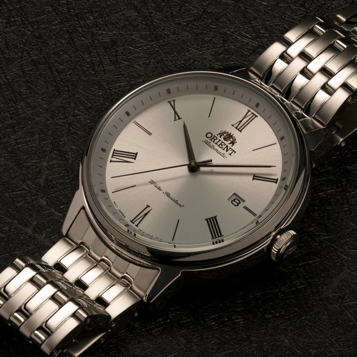 Men's automatic watch with silver Roman-numeral dial and stainless steel bracelet
