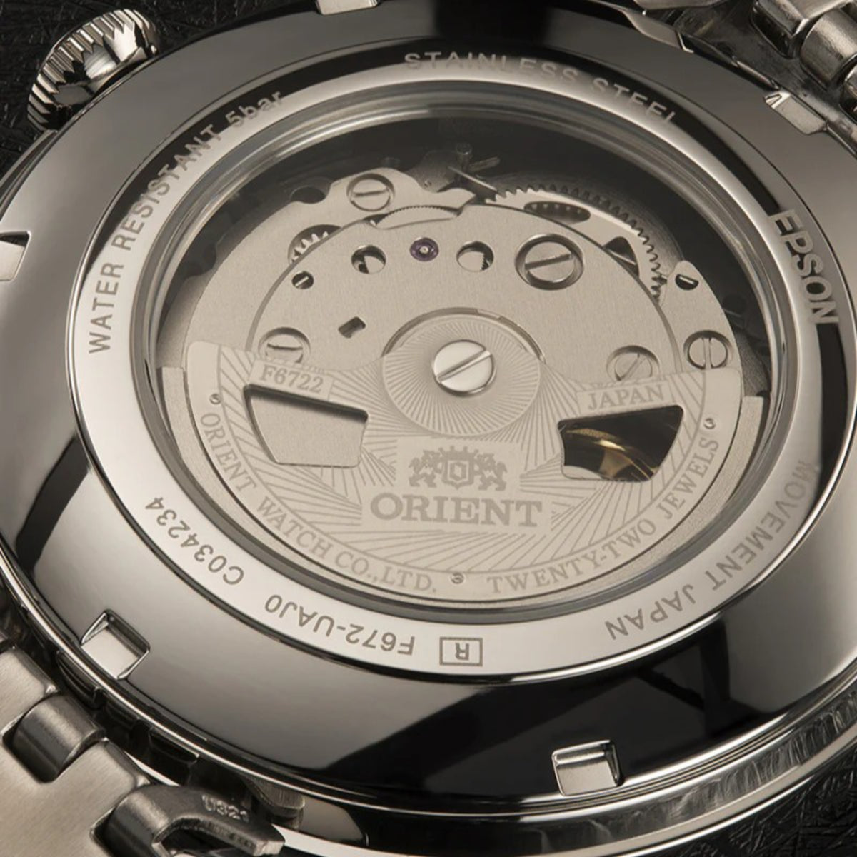 Stainless steel men's automatic watch caseback with exposed movement and Orient logo