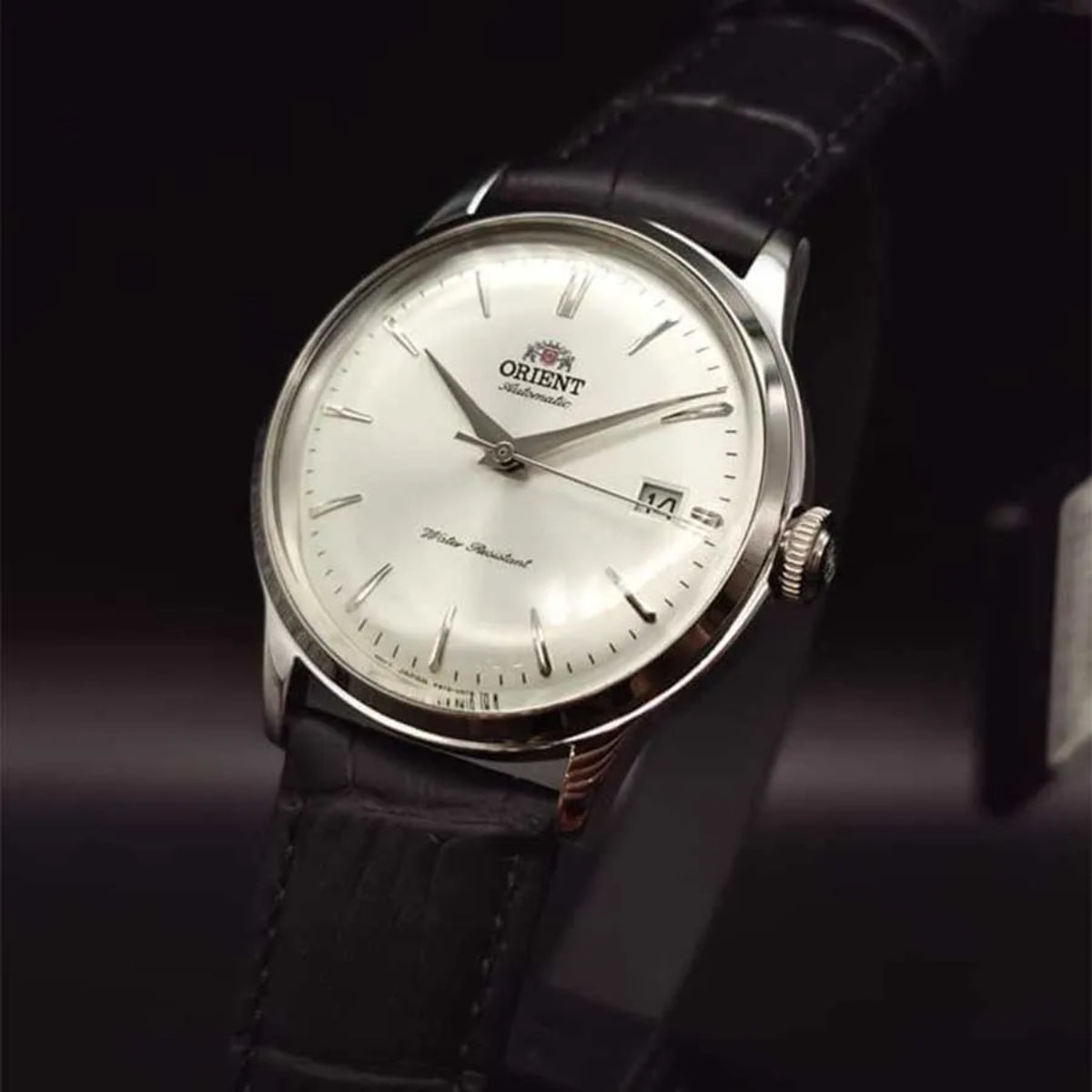 Orient Bambino RA-AC0M03S30B Automatic wrist watch with white dial and black leather strap, date window visible