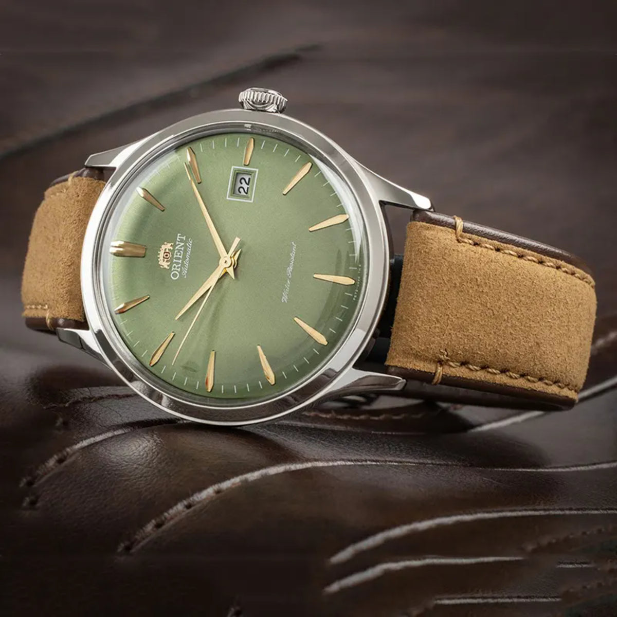 Orient Bambino RA-AC0P01E30B classic self-winding wristwatch displayed on a dark background, showing a domed crystal