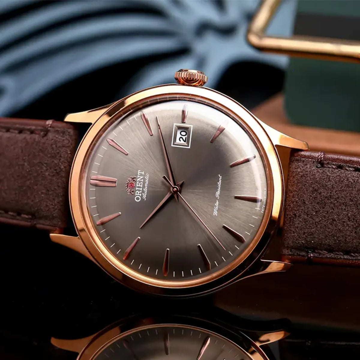 Orient Bambino RA-AC0P04Y30B close-up shot of bronze dial showing rose gold tone indices and date aperture