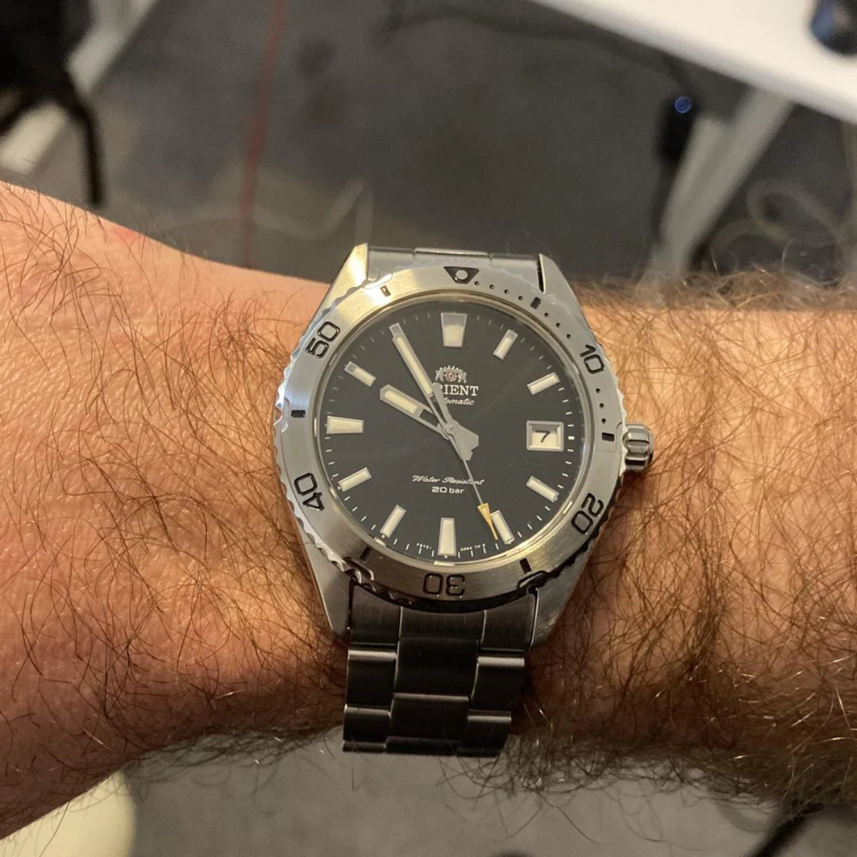 Orient Mako RA-AC0Q01B30B mens dive watch with black dial shown on wrist