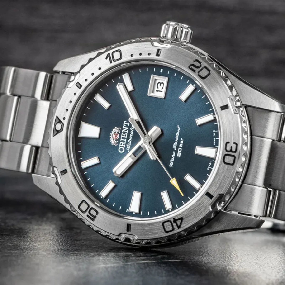 Automatic diver-style wristwatch with blue dial, minute bezel markings, steel bracelet