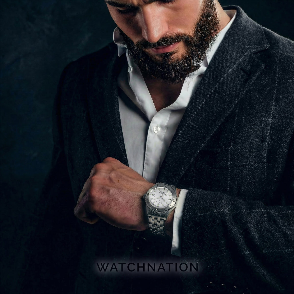Silver steel automatic diver watch on wrist with metal link bracelet and round dial