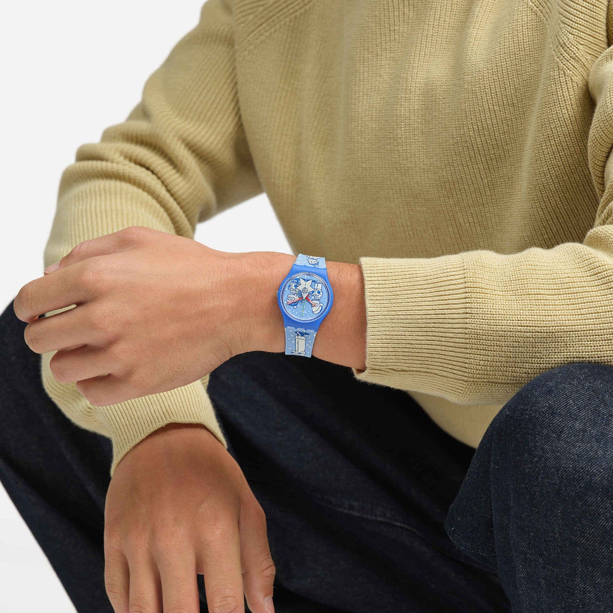 Blue silicone quartz watch on wrist with round blue character dial