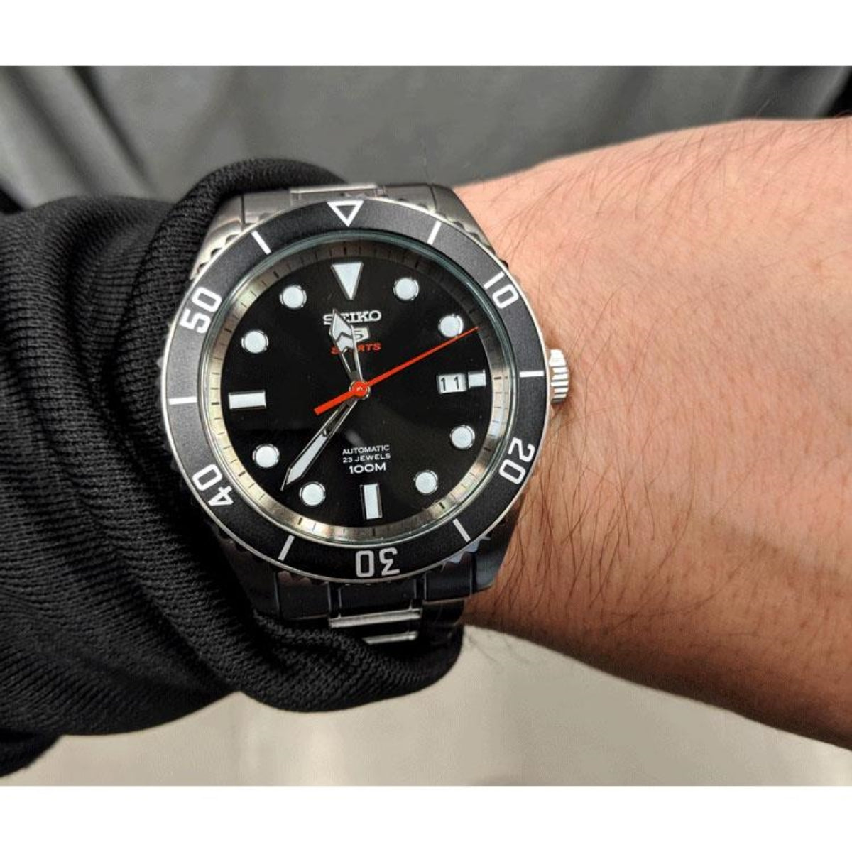 Seiko Sports SRPB91K1 black dial on a wrist lifestyle view