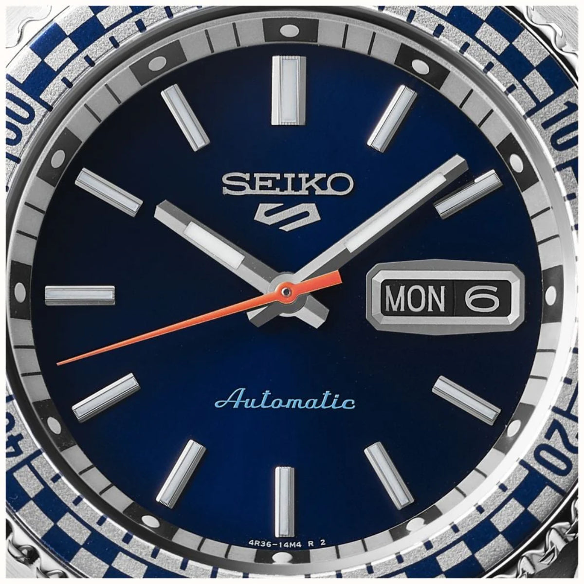 Seiko 5 Sports SRPK65K1 blue sunburst dial and checker flag bezel close up
