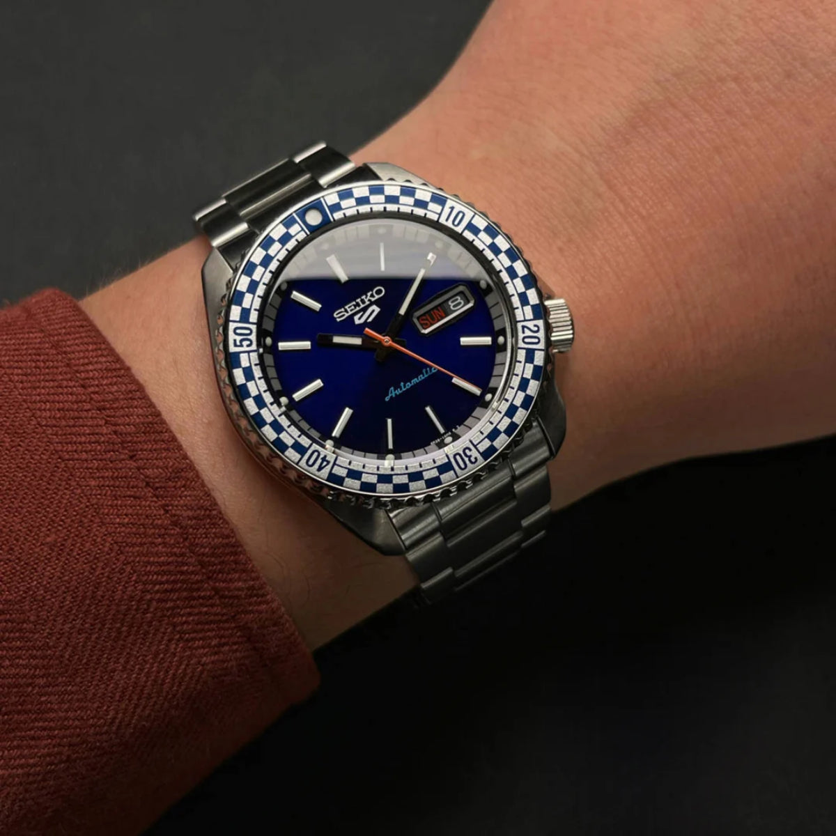 Seiko 5 Sports SRPK65K1 blue dial watch on wrist lifestyle view