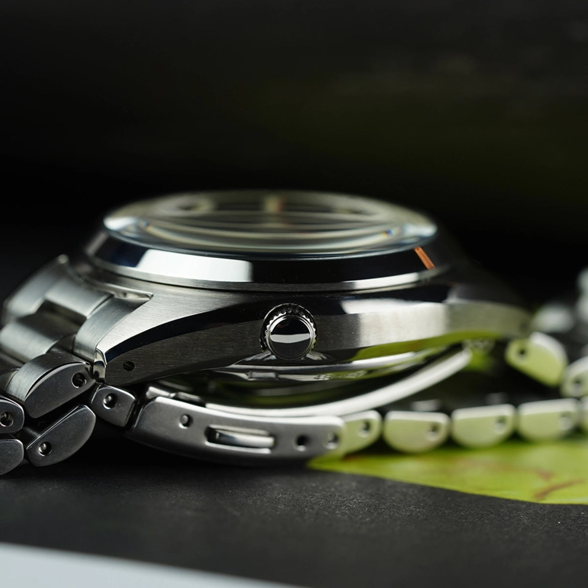 Close-up side profile view of the Seiko SNXS 5 Sports case, displaying the polished bezel, the crown and case thickness