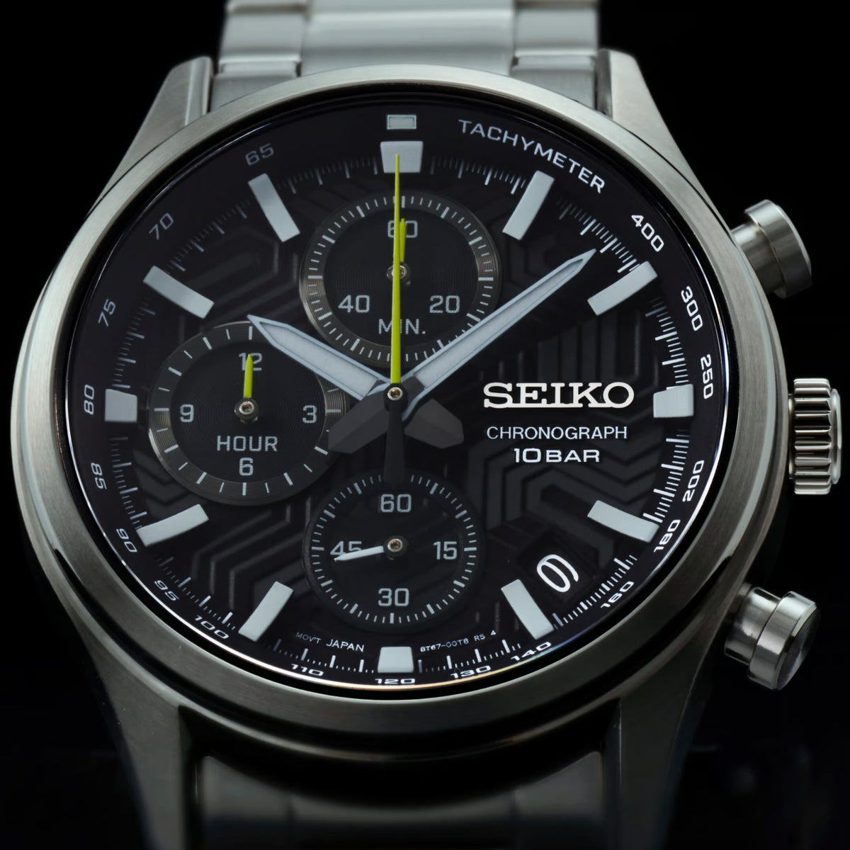 Seiko chronograph wristwatch close view, black dial with tachymeter ring and subdials