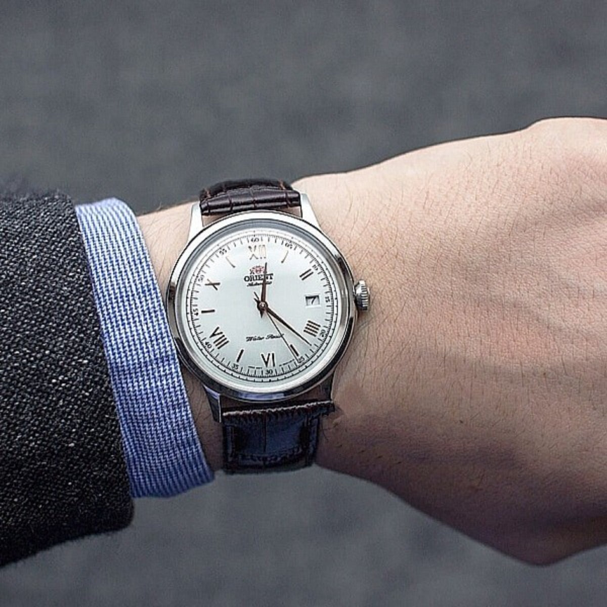 Orient Bambino TAC00008W0 watch on a wrist view