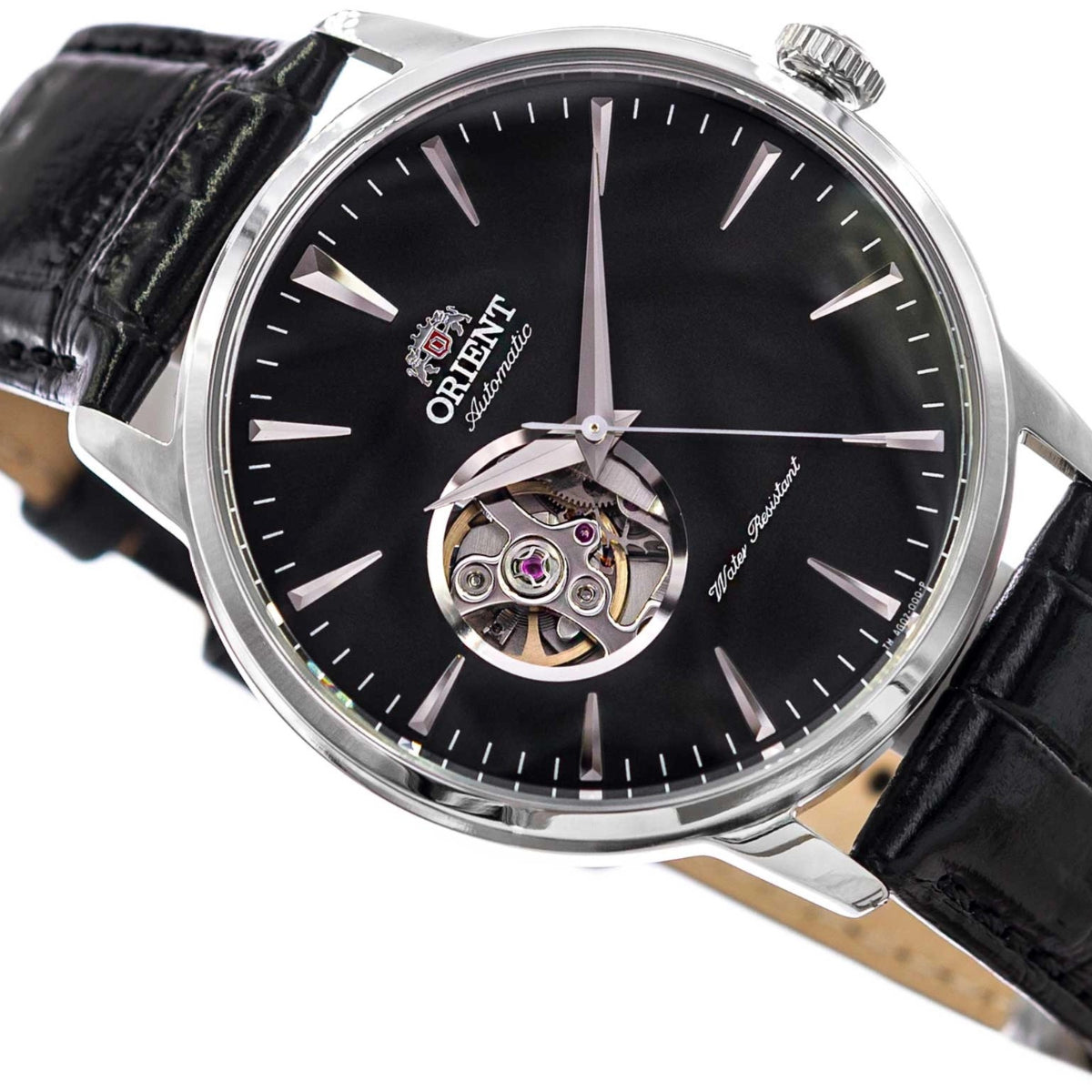 Orient automatic watch close-up showing black dial, open-heart movement, and silver hands