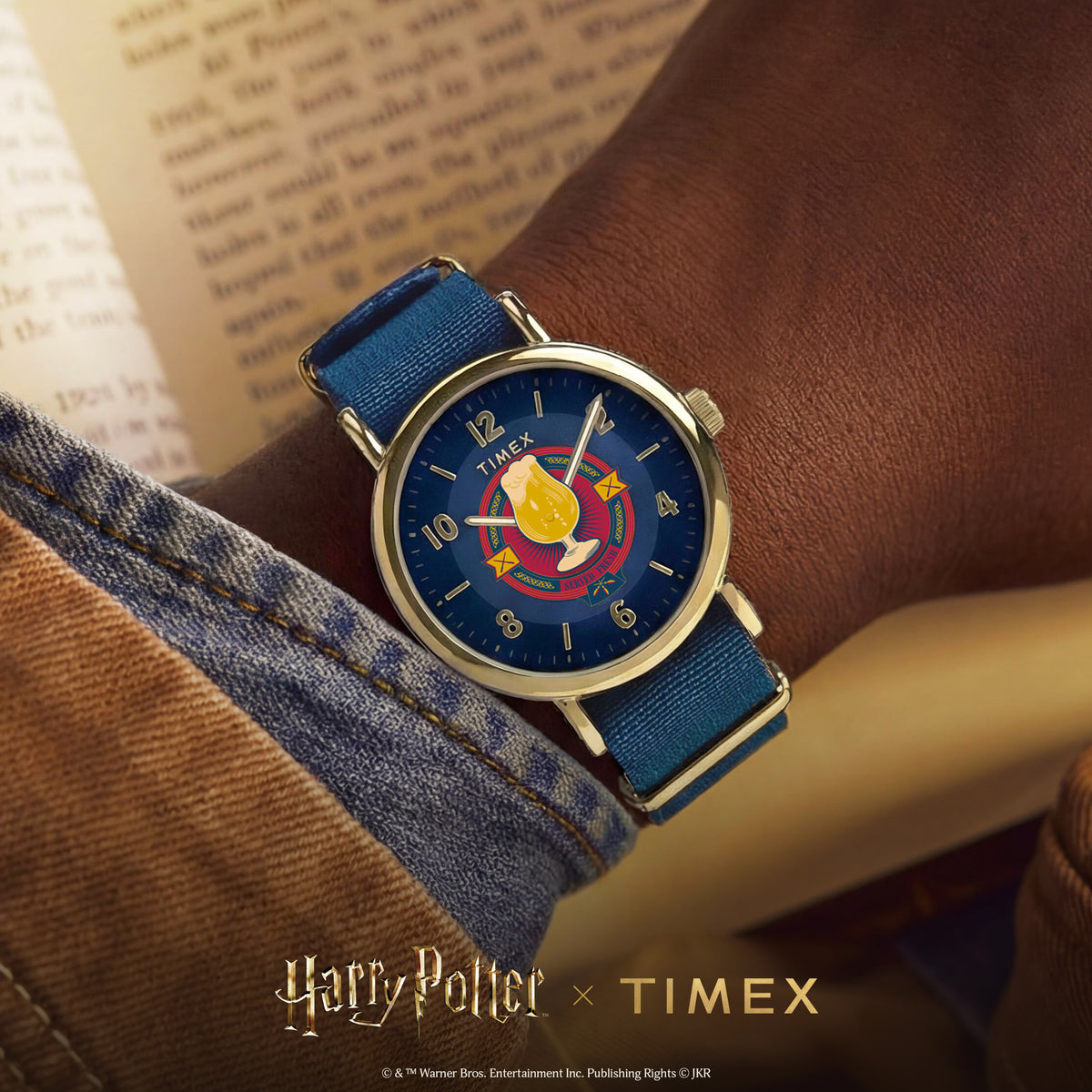 Men's quartz watch with gold-tone case, blue dial, and blue fabric wrist strap
