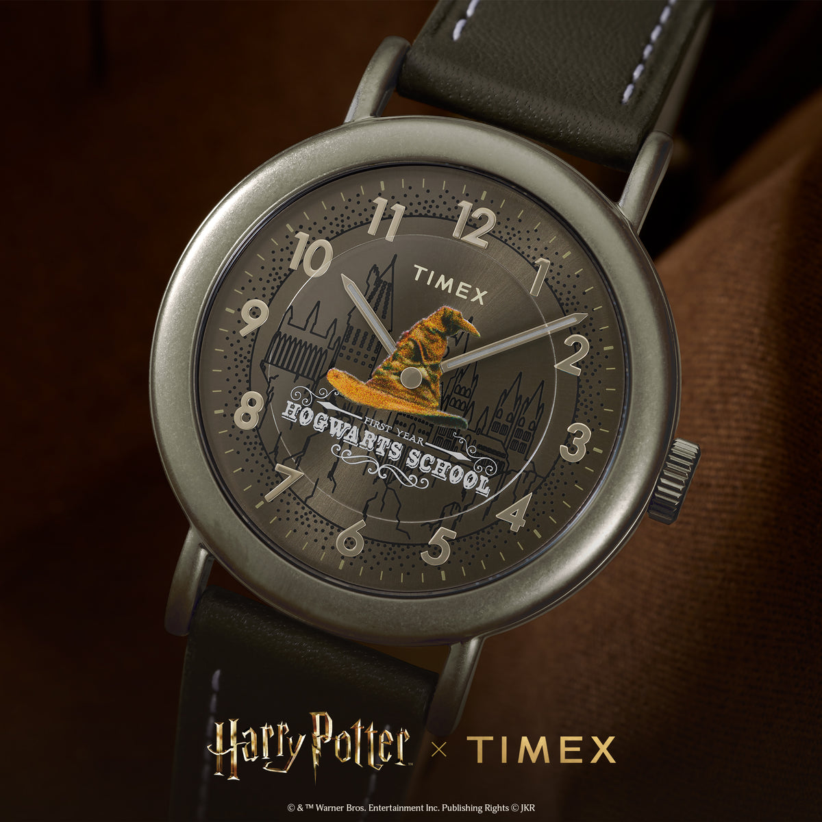 Timex Weekender watch TW2Y77000 close-up: brown dial with Hogwarts Sorting Hat graphic and brown leather strap