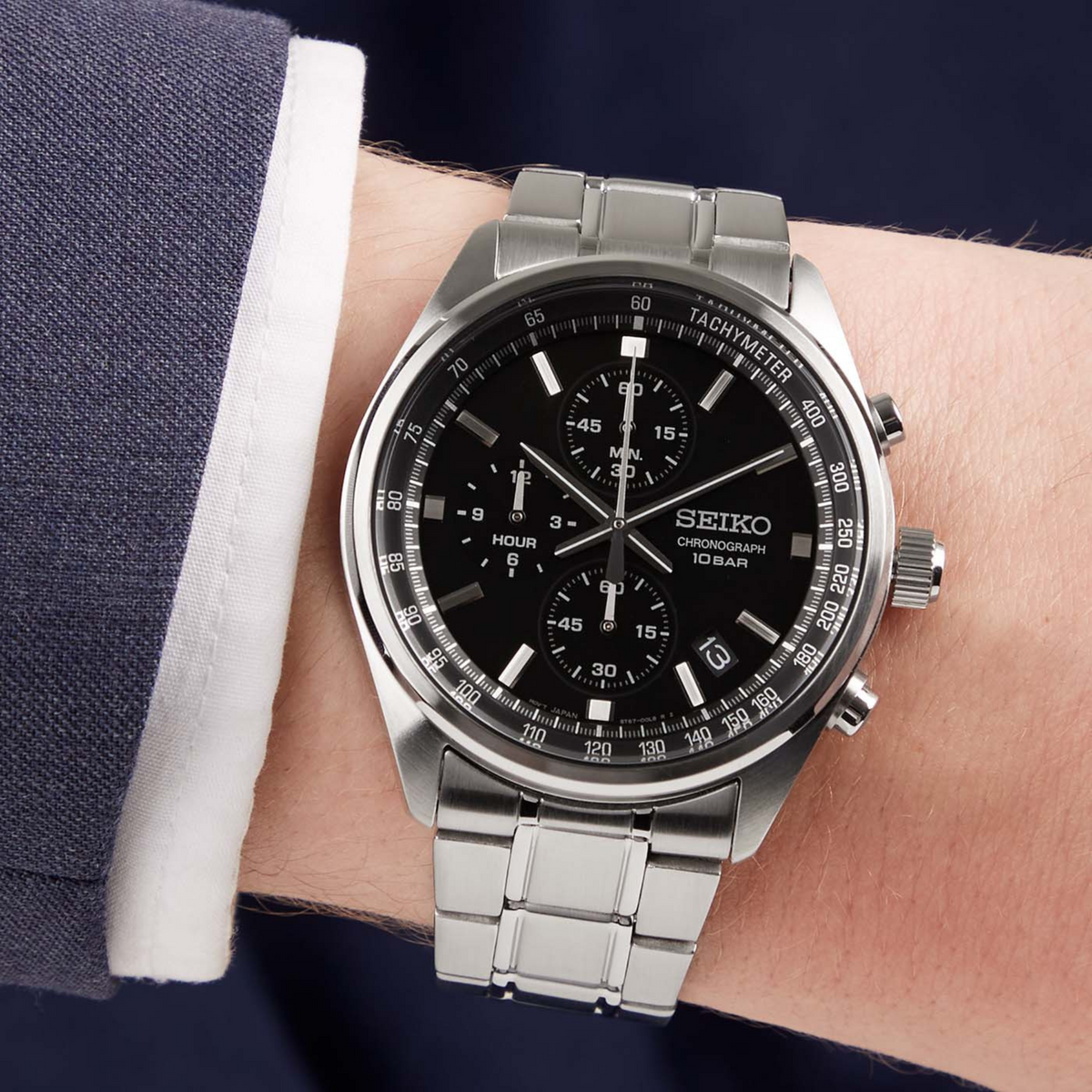 Seiko Essentials SSB379P watch with black dial and stainless steel bracelet on wrist