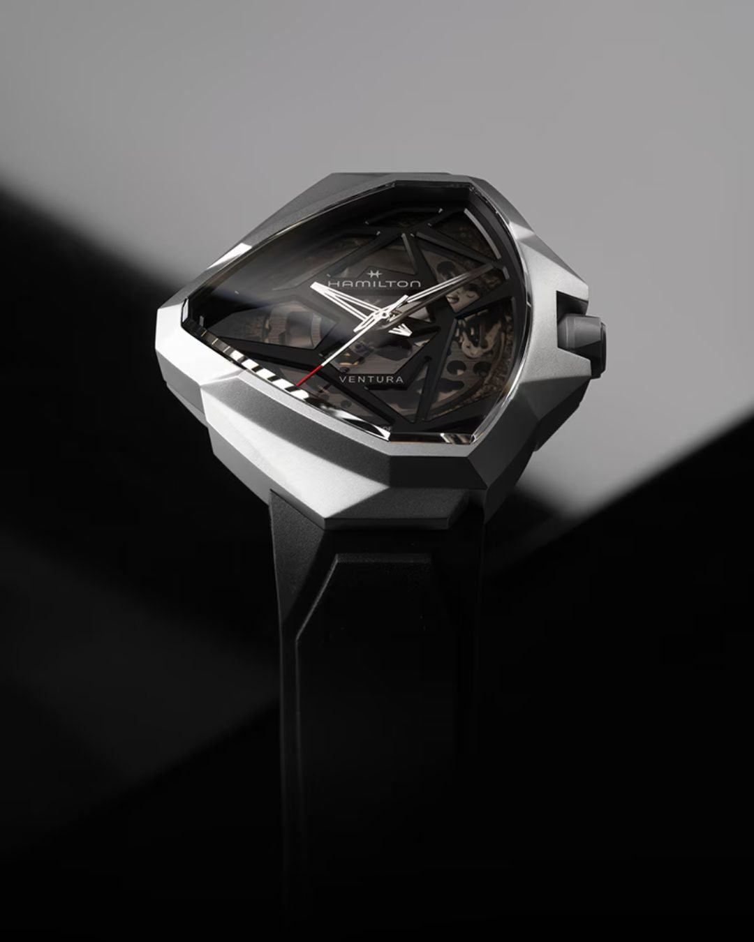 Hamilton Ventura futuristic triangular skeleton dial watch with silver case and black rubber strap