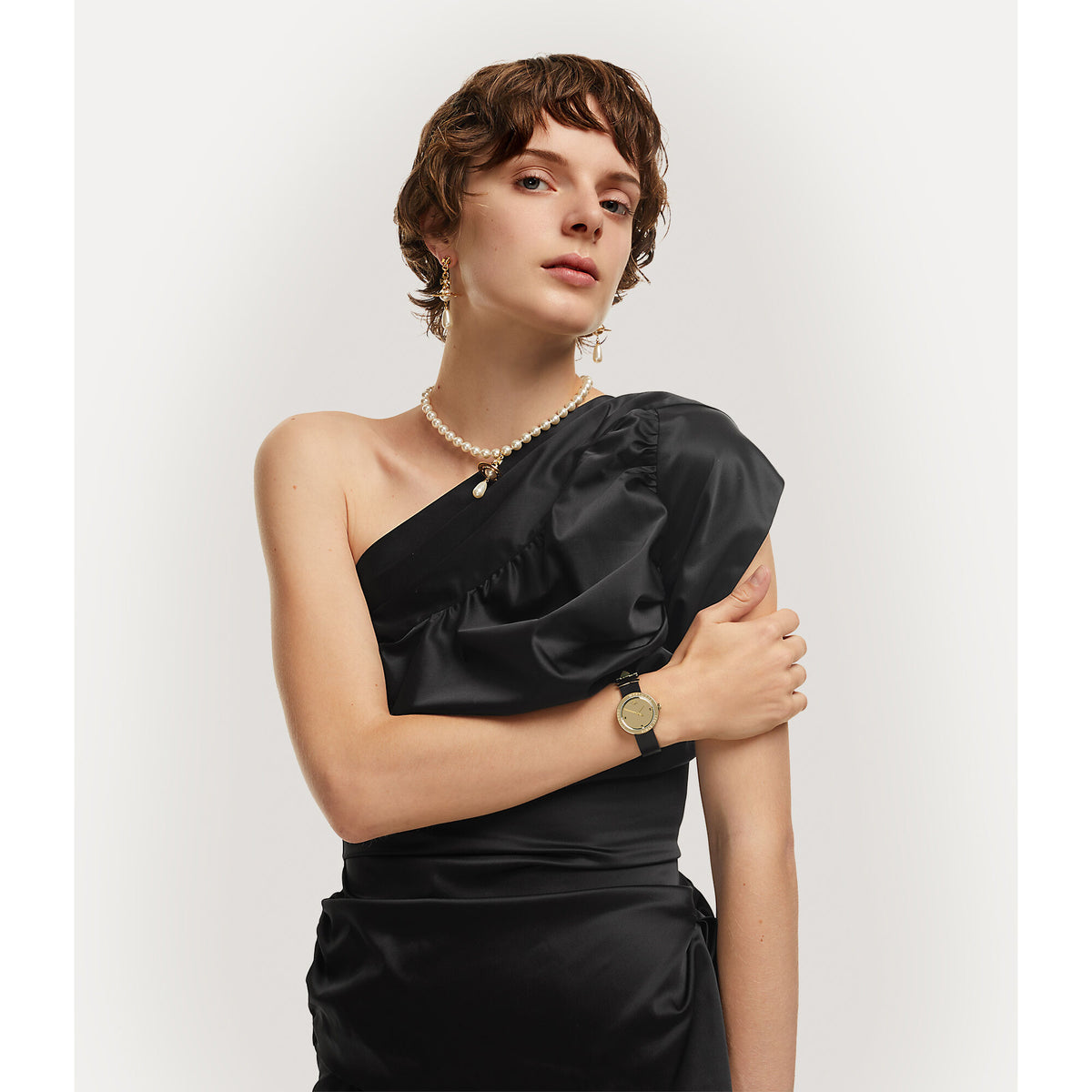 Vivienne Westwood VV303BKGD women's watch on model's wrist showcasing gold dial and black strap