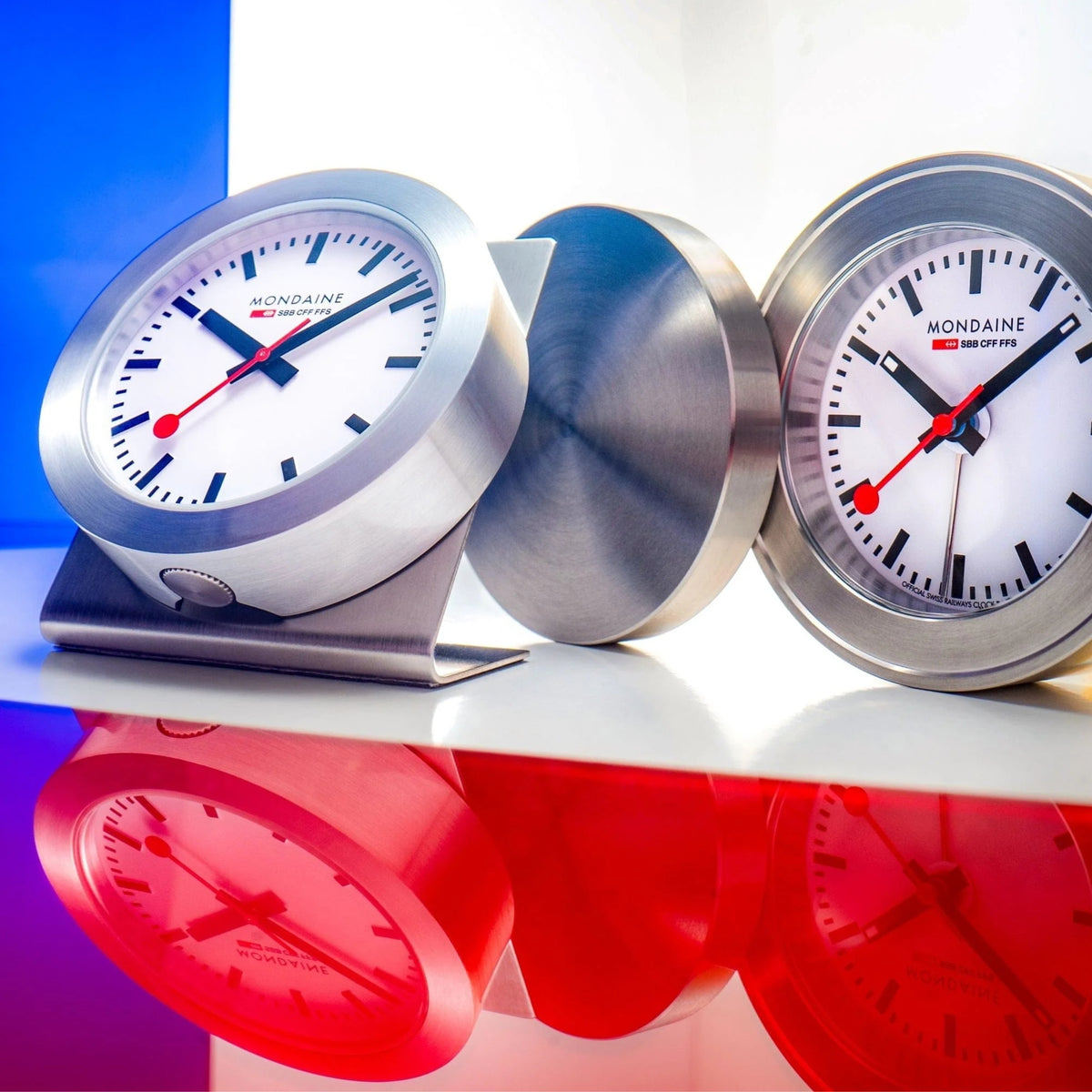 Mondaine aluminum case quartz magnet clock, white face, red hands, twin view