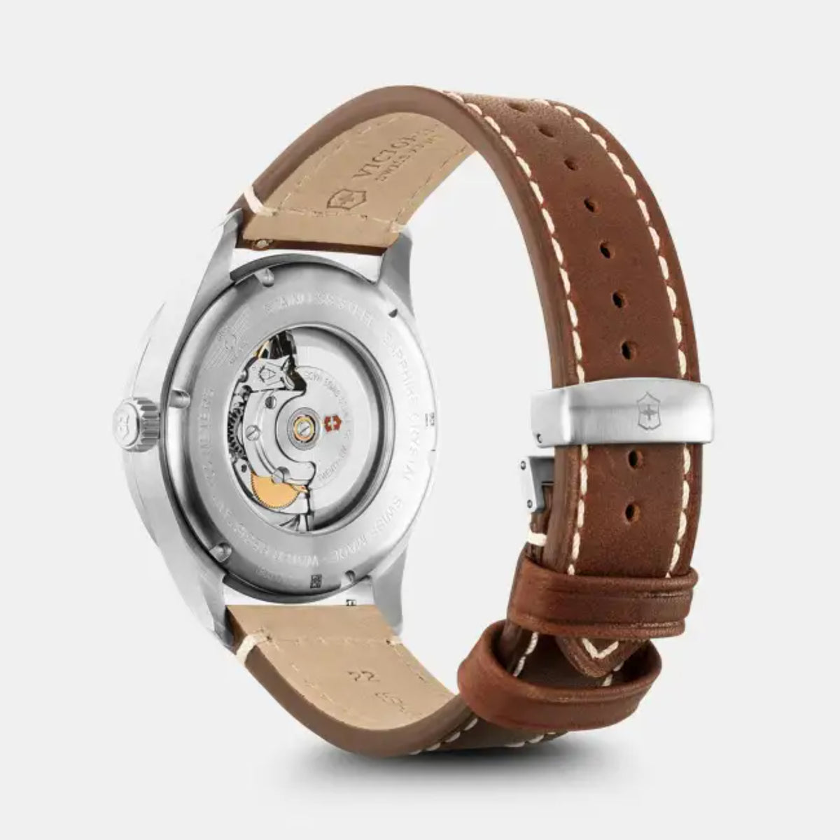 Victorinox automatic watch back view with visible movement and brown leather strap