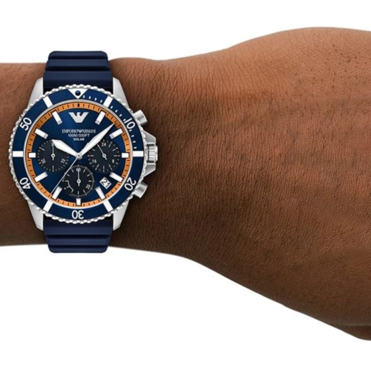 Men's solar chronograph watch on wrist with blue silicone band and blue dial