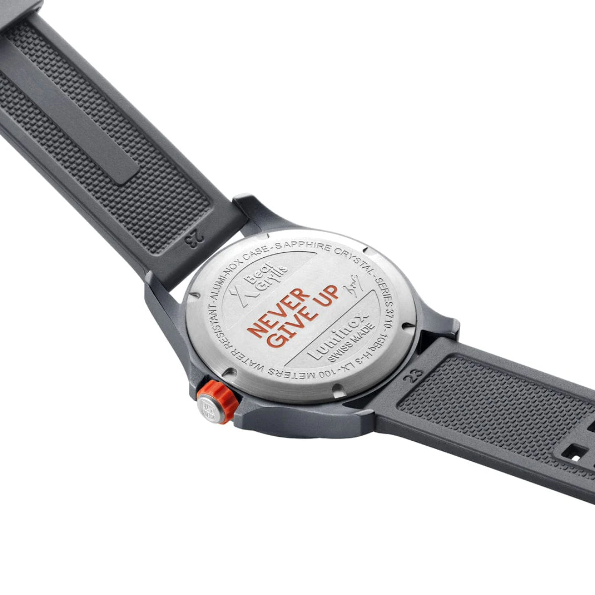 Stainless steel case back of the Luminox Bear Grylls Survival XB.3716 featuring the engraved 'Never Give Up' motto and signature strap