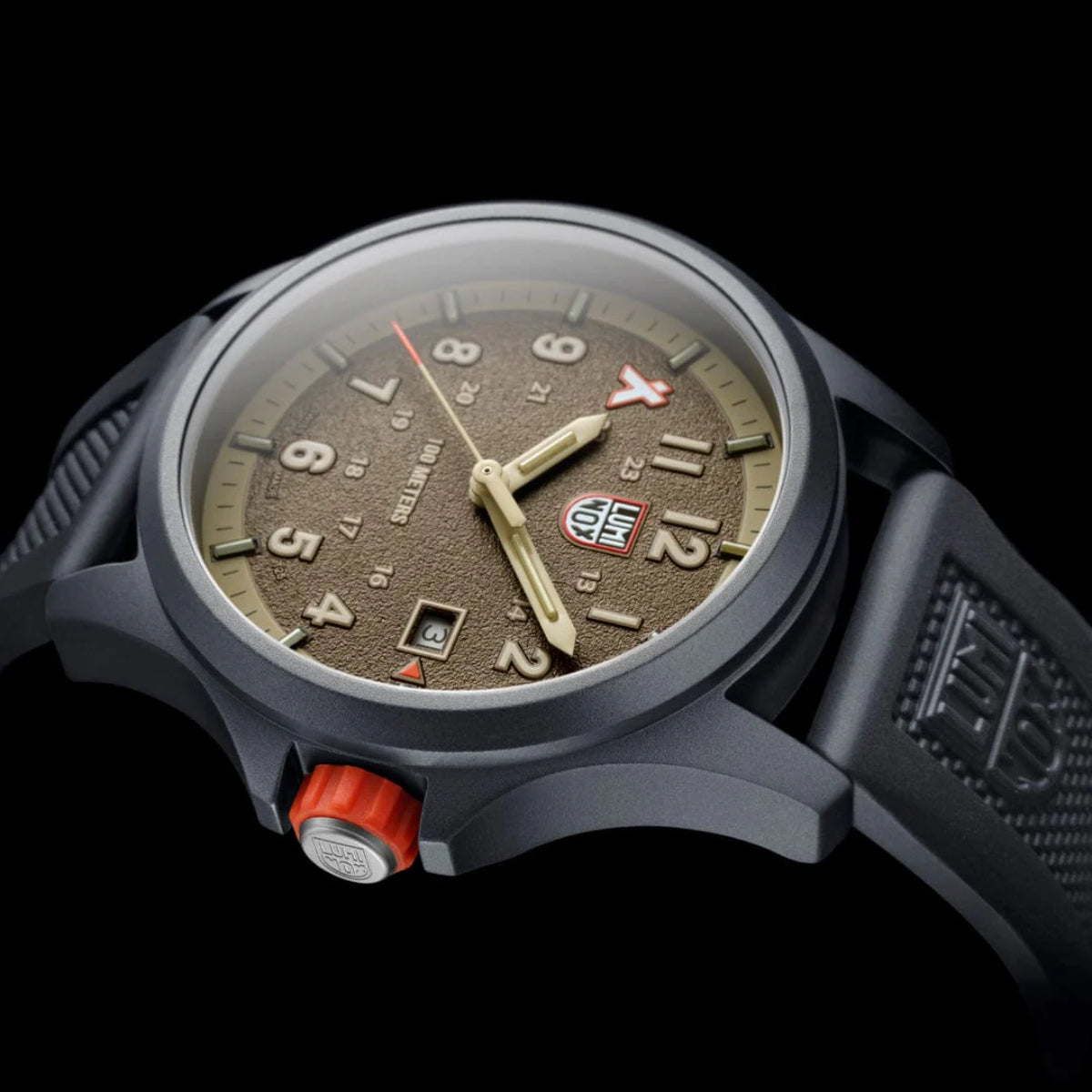Detailed side angle showing the textured orange crown, dark case, and glass crystal of the Luminox Bear Grylls Survival XB.3716
