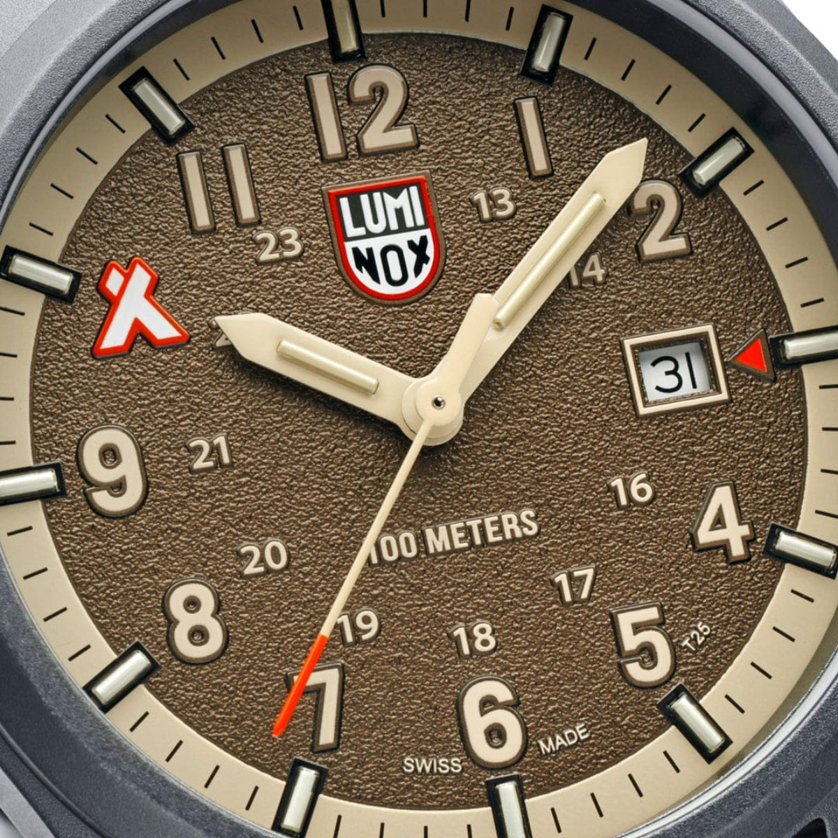 Close-up of the sand-textured brown face, date display, and signature logo on the Luminox Bear Grylls Survival XB.3716