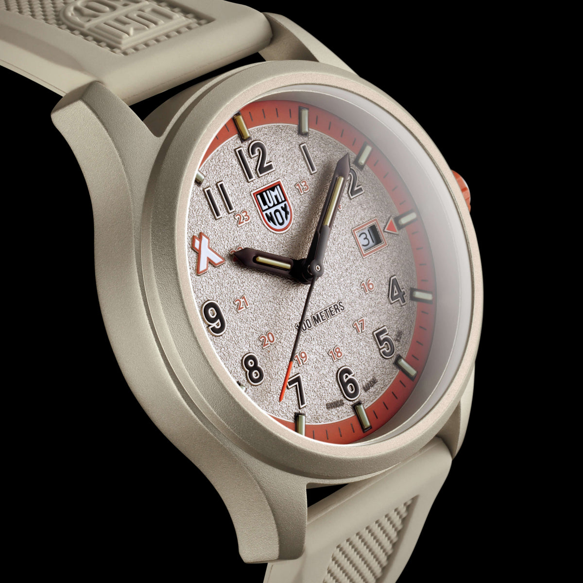 Angled studio view displaying the clear sapphire crystal, textured face, and light-colored body of the Luminox Bear Grylls Survival XB.3717
