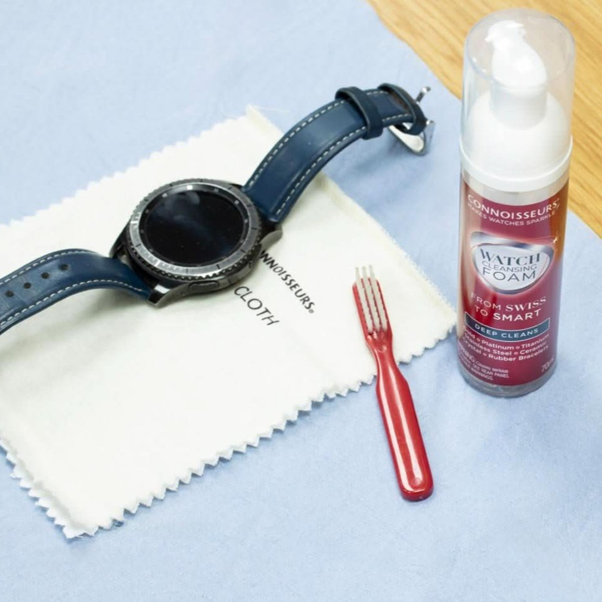 Connoisseurs CONN789 watch care kit contents alongside smart watch