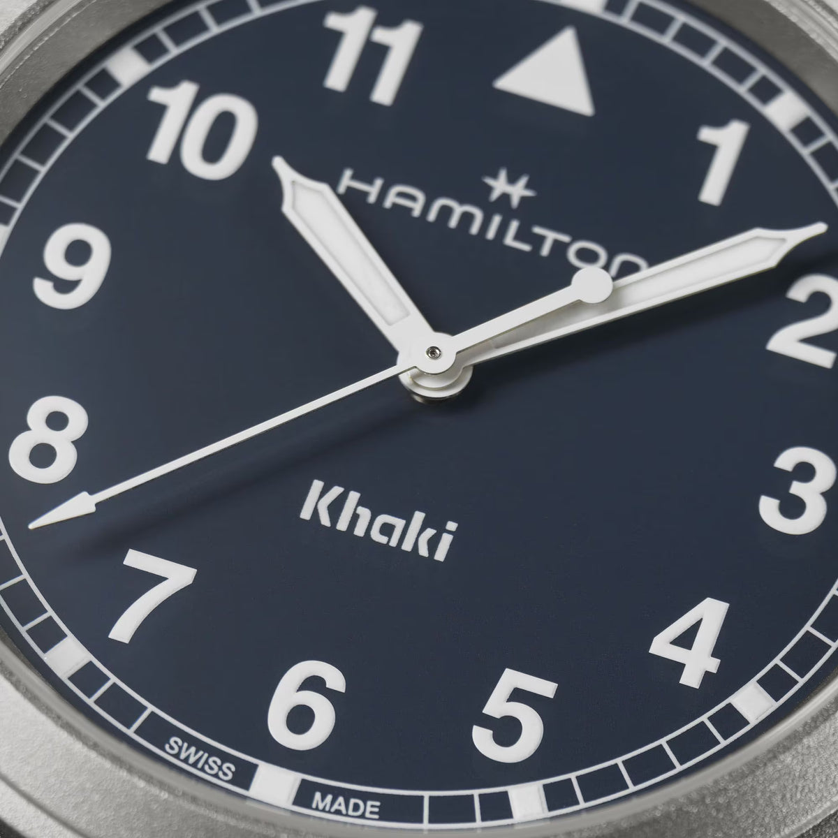 Close-up of blue dial with silver hands, Hamilton branding, and Khaki markers