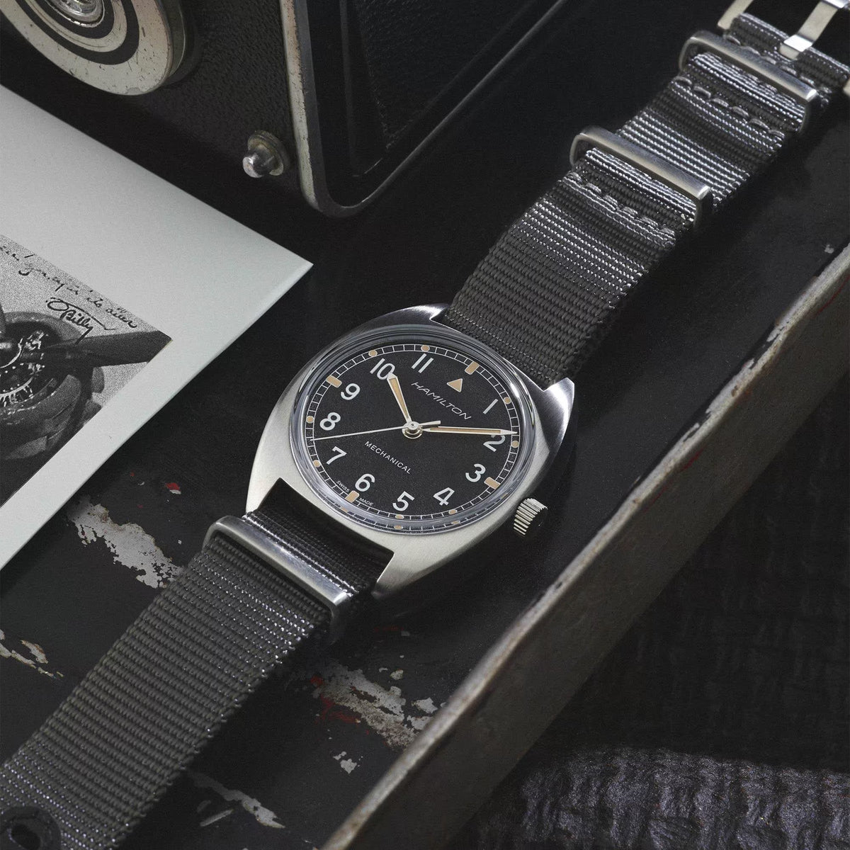 Hamilton mechanical pilot watch on dark gray NATO strap, dial close-up
