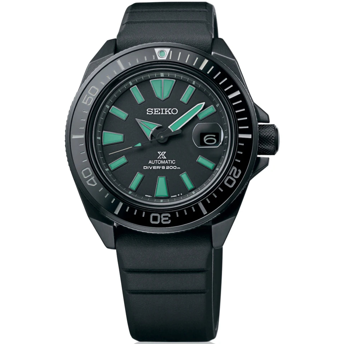 Black Seiko diver watch with green hour markers, black silicone strap, automatic movement