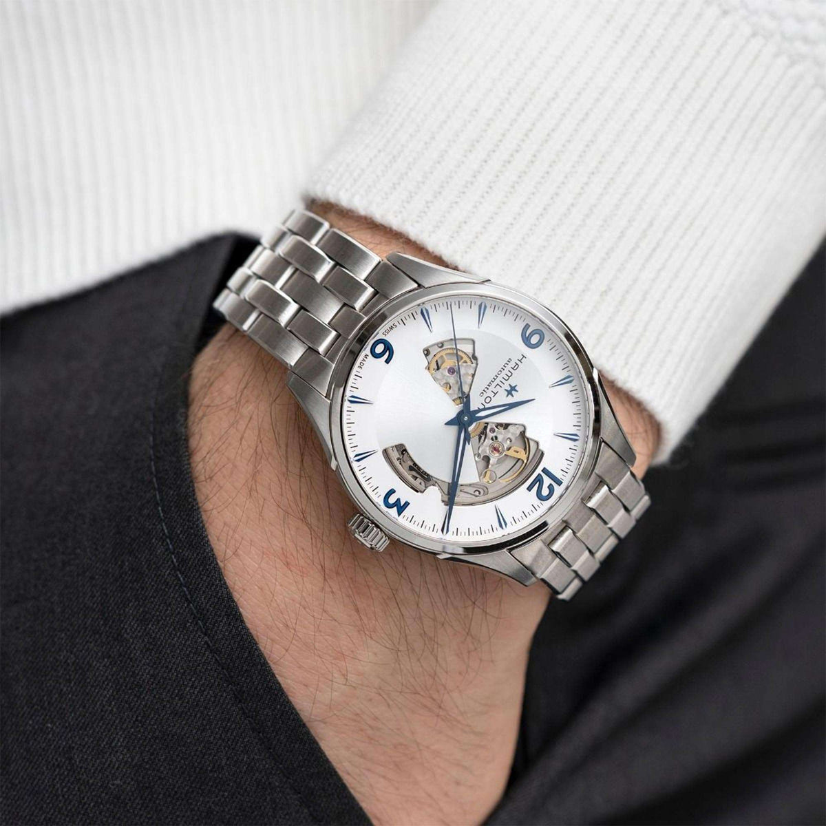 Men's automatic open-heart watch on wrist, silver steel bracelet, white dial, blue numerals