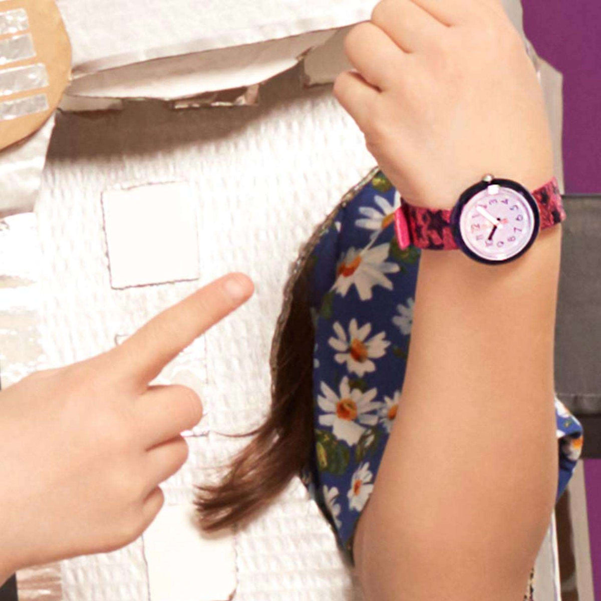 Girls purple dial quartz watch on wrist with glitter purple textile band
