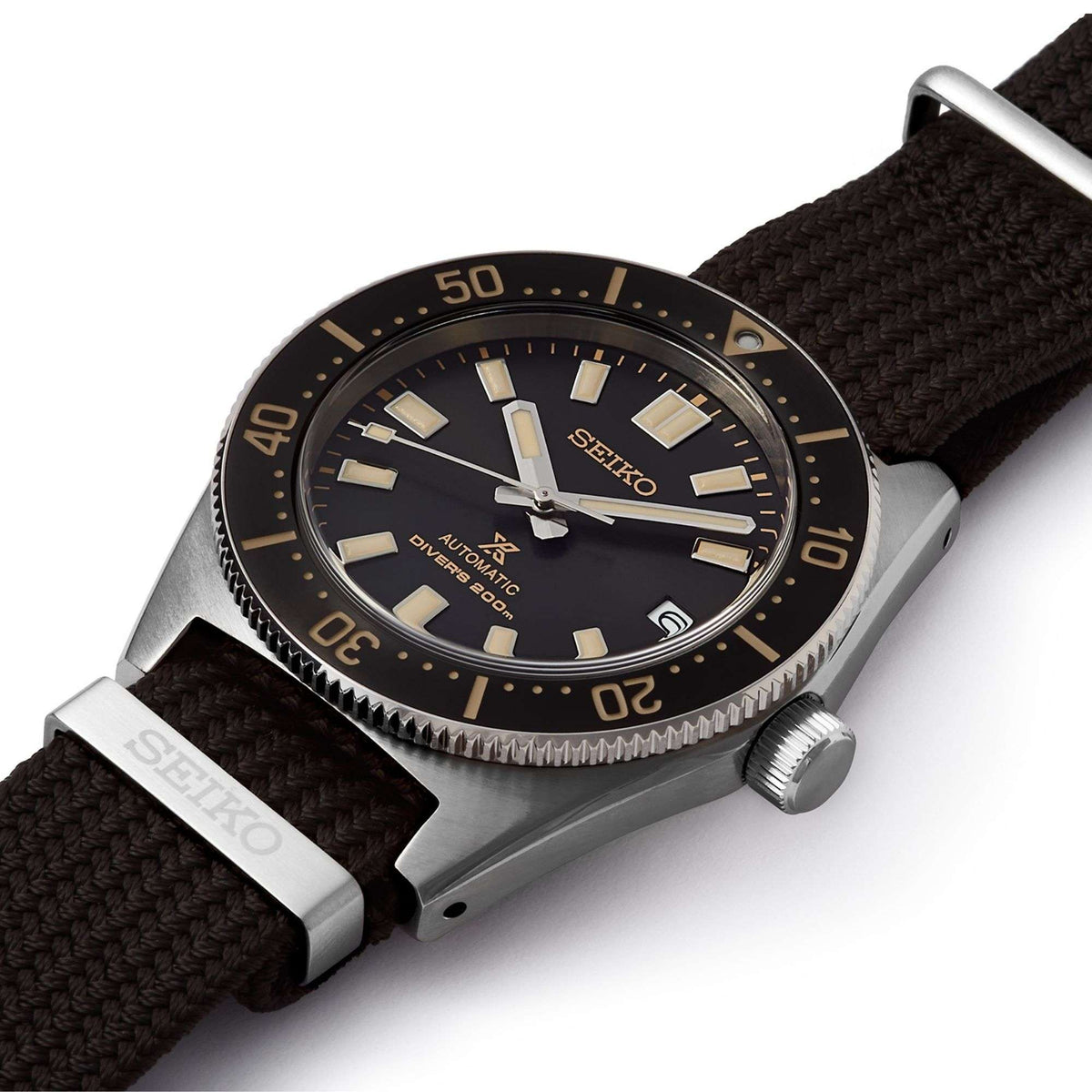 Men's Seiko diver watch with black dial, gold markers, and brown nylon strap