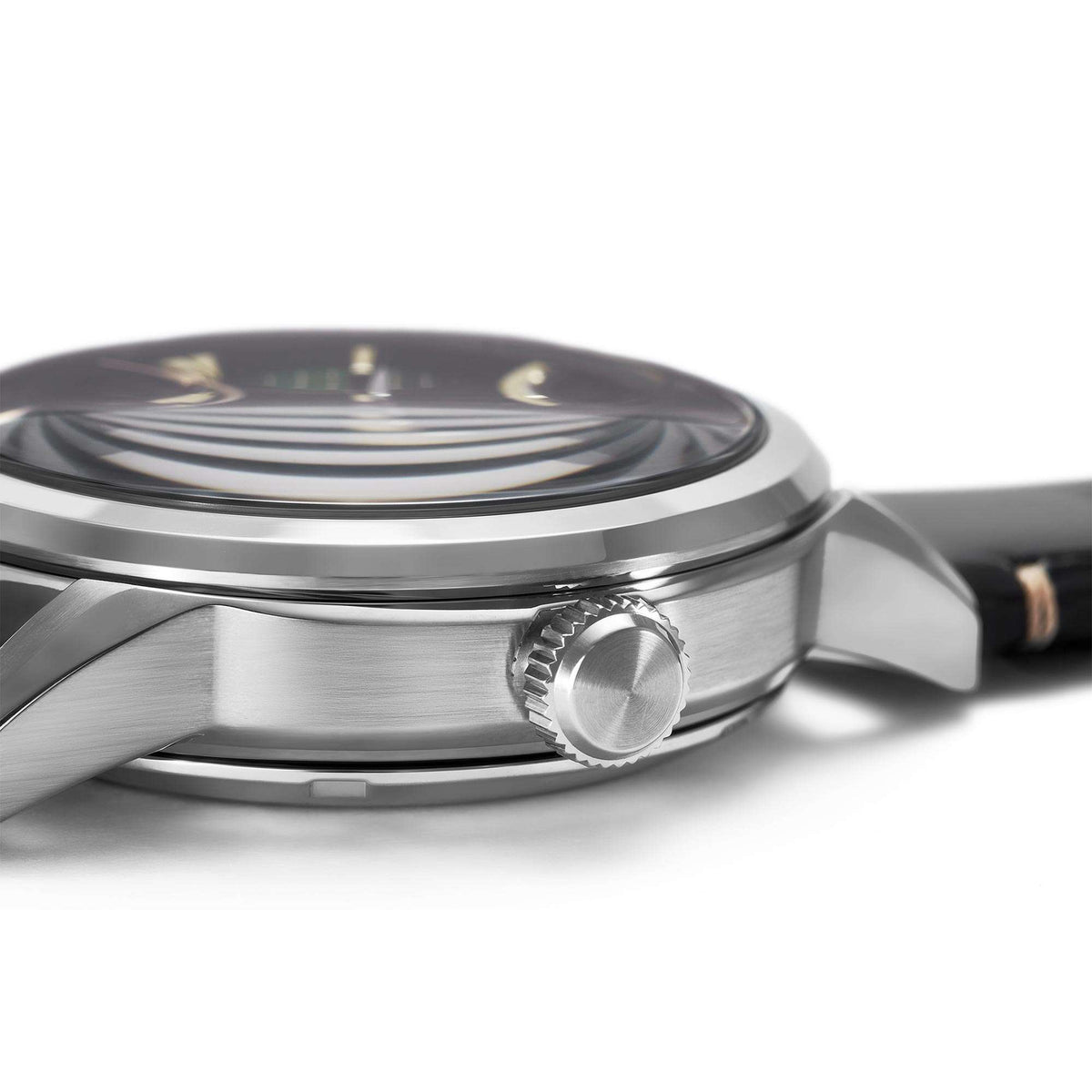 Stainless-steel watch case with crown and bezel edge; green dial visible