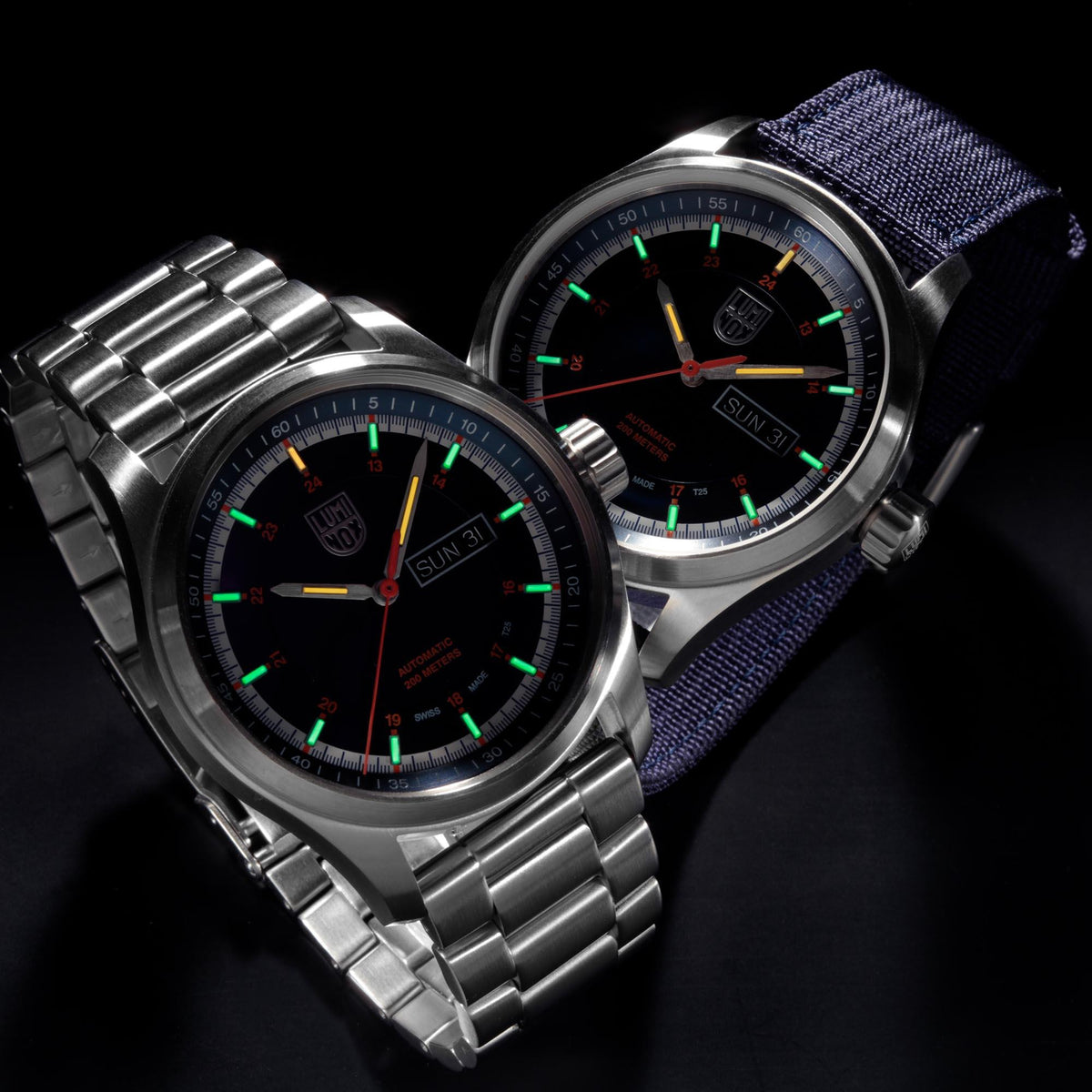Pair of men's automatic watches, steel bracelet and navy strap, blue dials