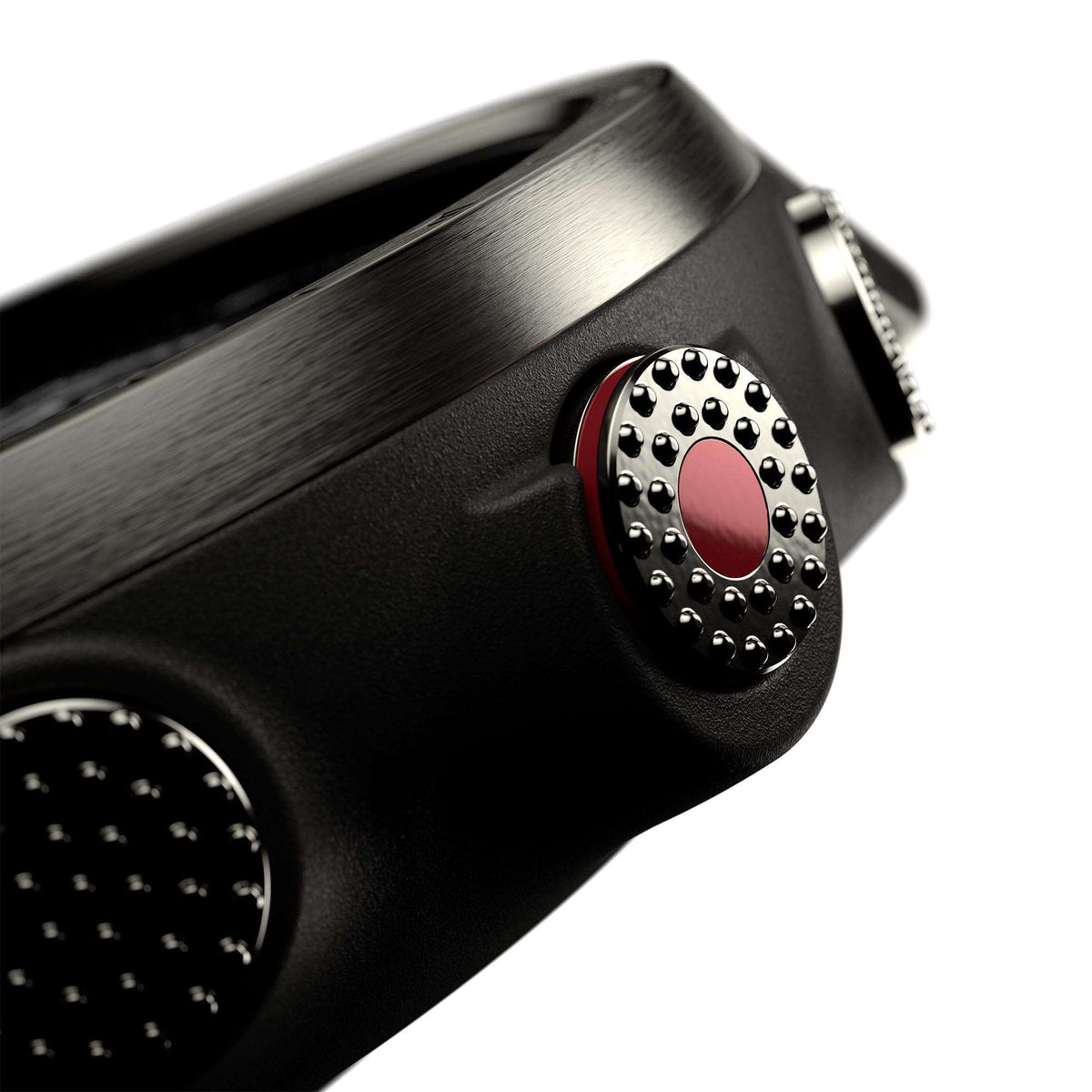Smartwatch strap connector detail with circular metal emblem and red rubber trim.