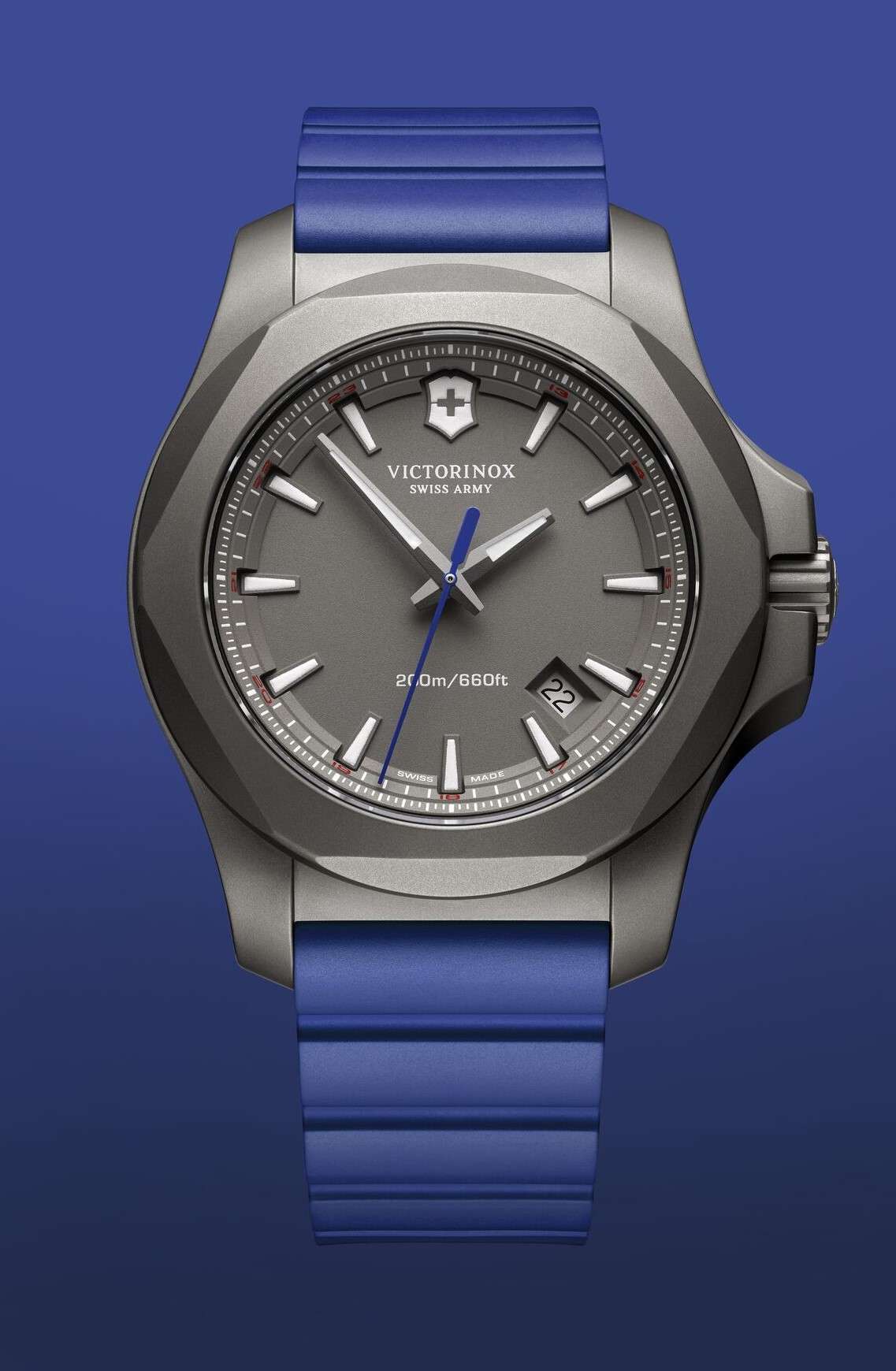 Men's sports watch with blue rubber strap, grey titanium bezel, dark dial with baton hour markers