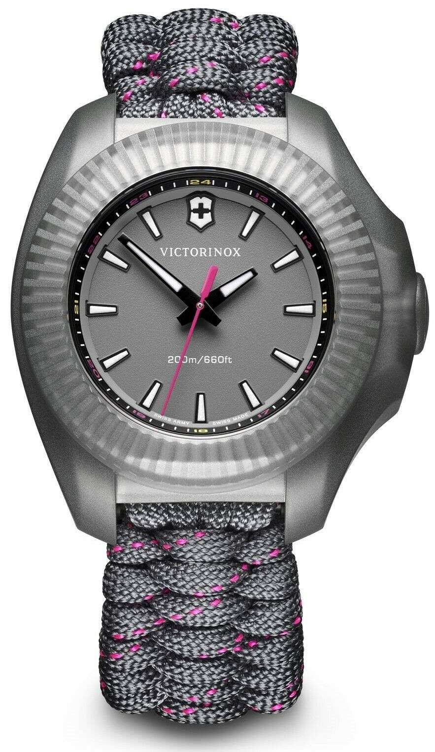 Round silver stainless steel watch with dark dial, pink hand, and textured gray paracord band