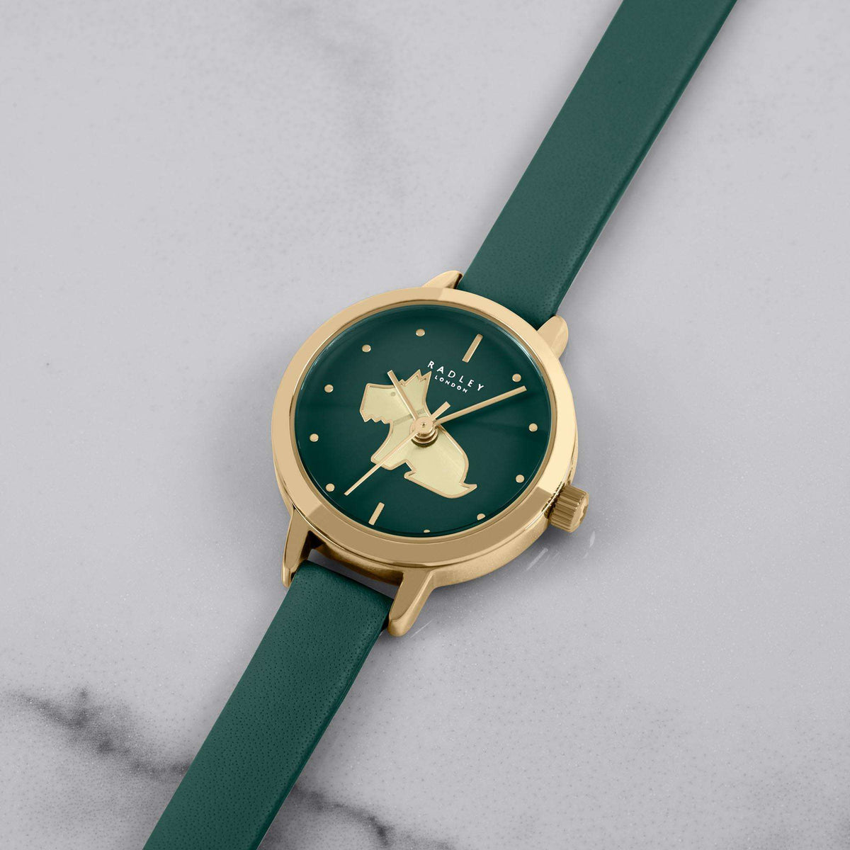 Teal leather strap watch angled view, round gold case with green dial and horse motif