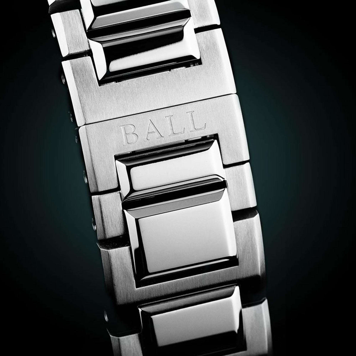 Stainless steel bracelet link close-up with brushed metal finish