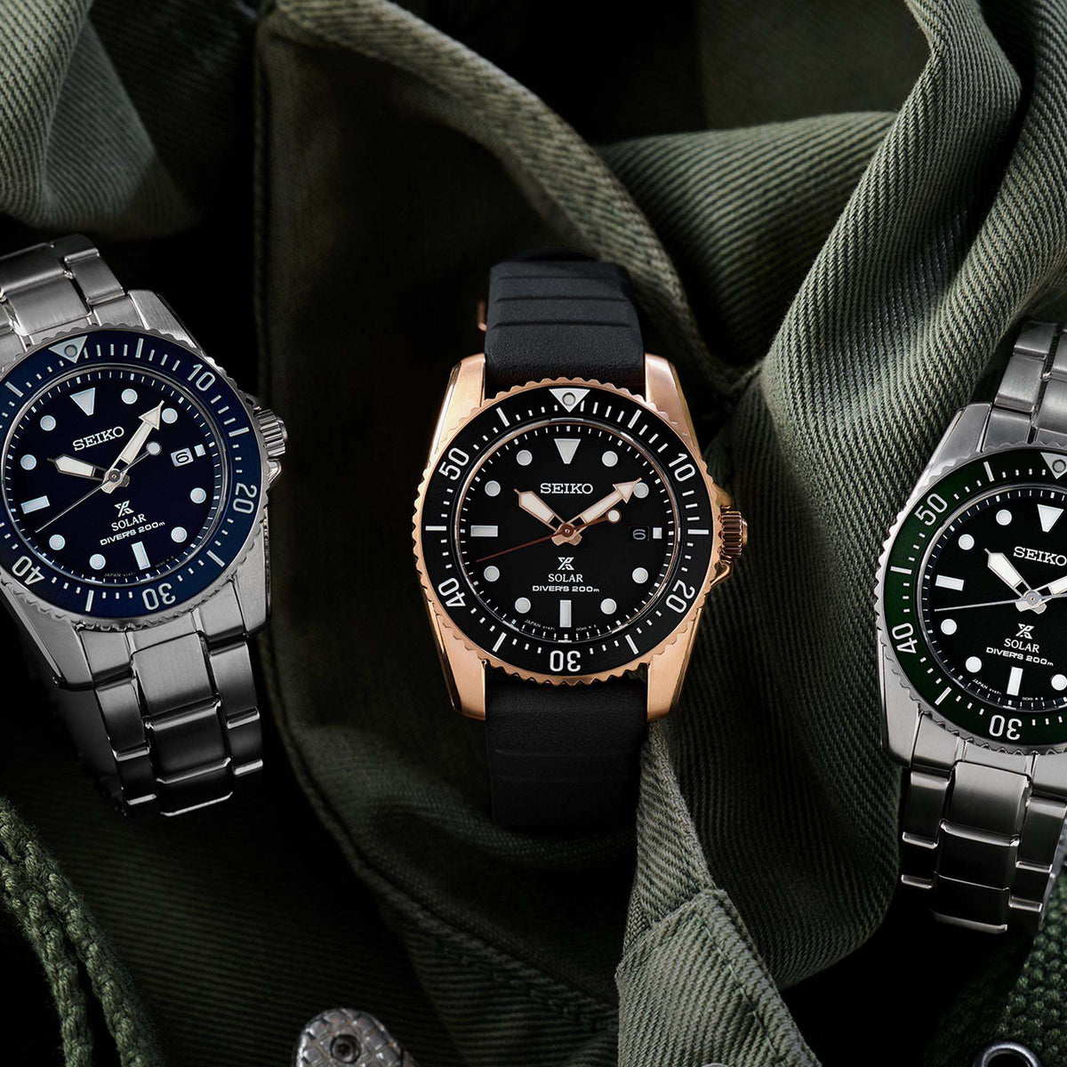 Seiko Prospex solar watch with black dial, black strap, and gold-tone bezel