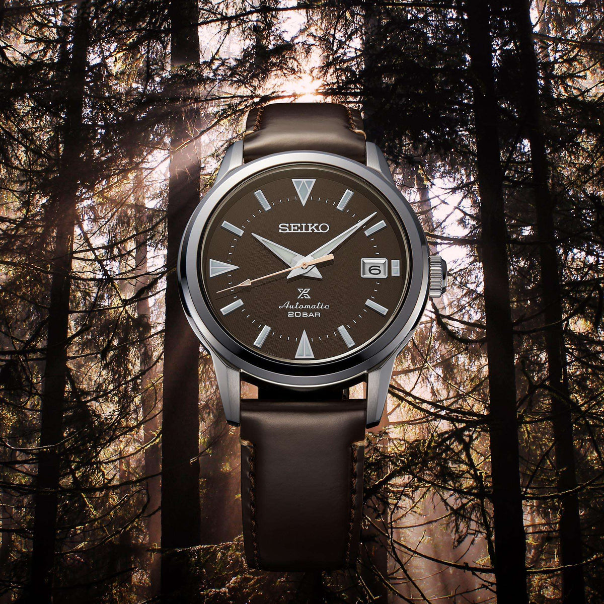 Men's automatic watch with brown dial and dark brown leather strap, stainless bezel and case.